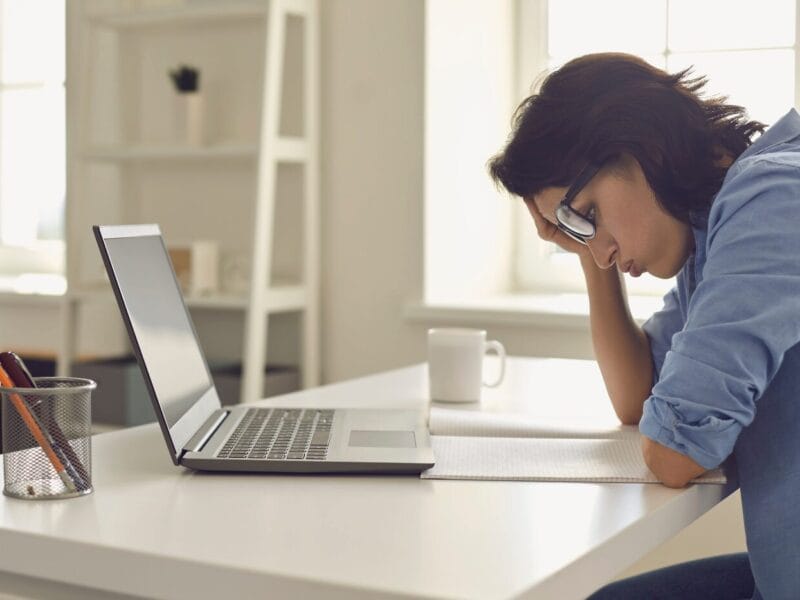 business owner stressed about payroll errors on computer