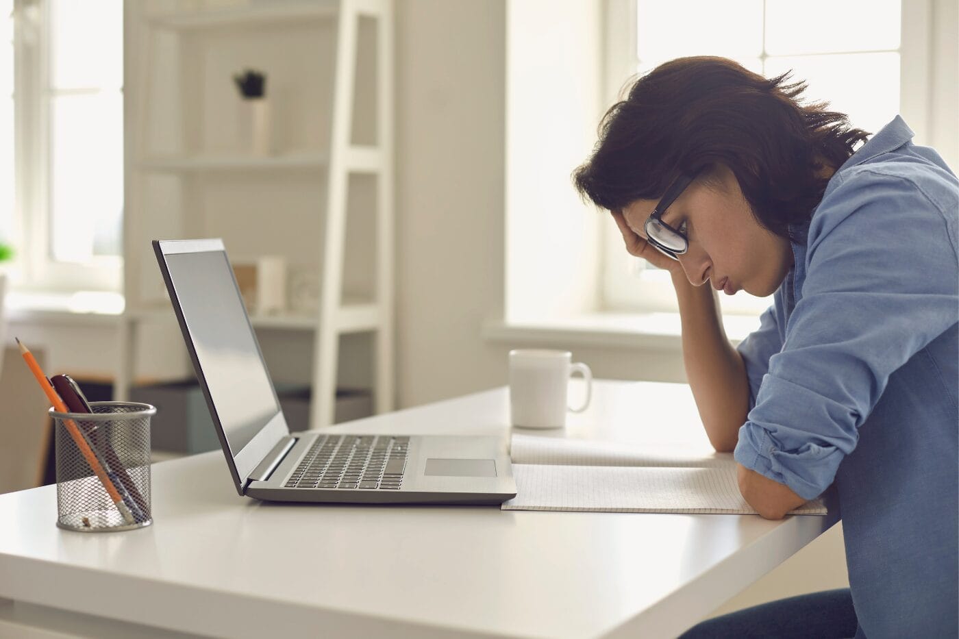 business owner stressed about payroll errors on computer